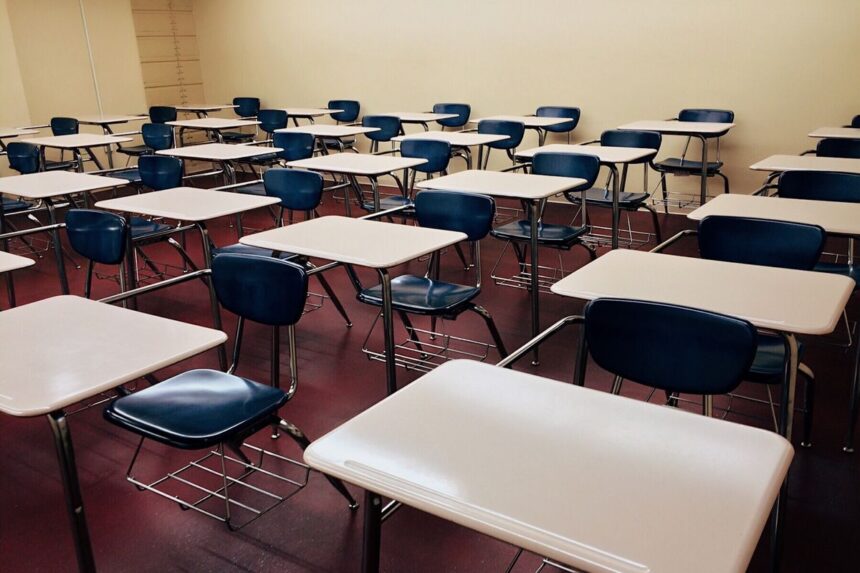 Empty classroom with rows of desks at a Denville school