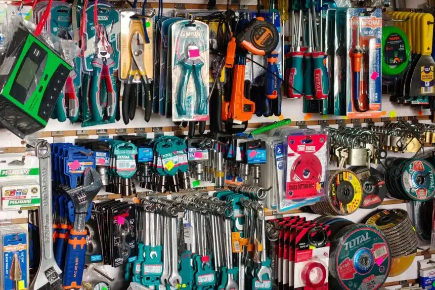 Wall of hand tools and hardware supplies inside a hardware store