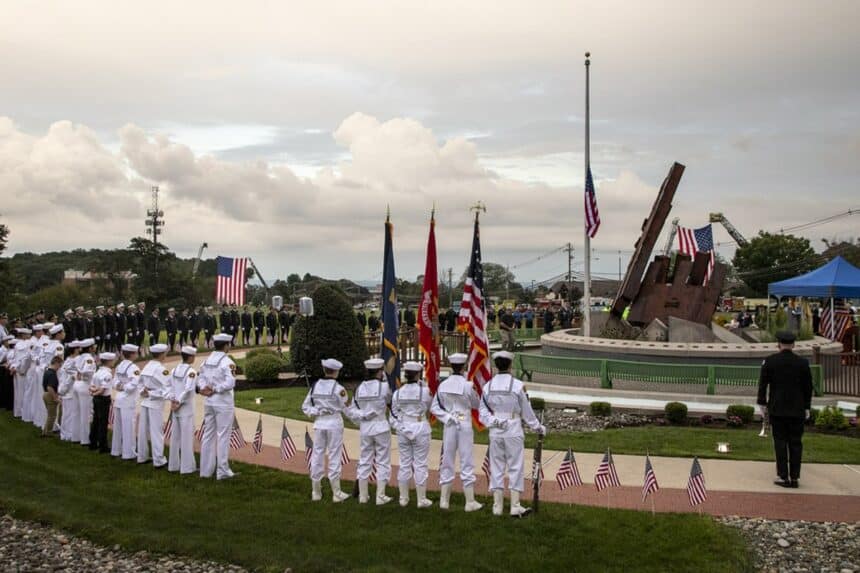 Cadets and first responders stand in formation around the steel beam at the Morris County 9/11 Memorial during a remembrance ceremony