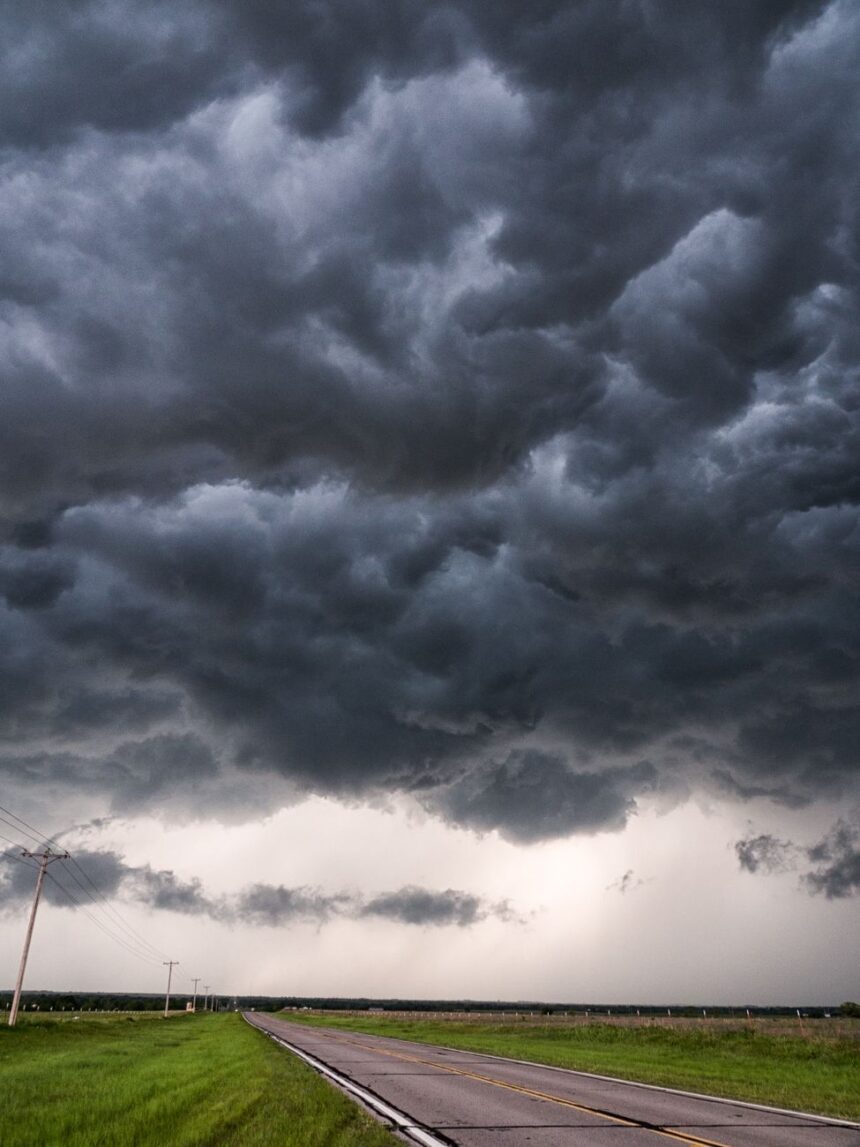 dark clouds over the countryside road