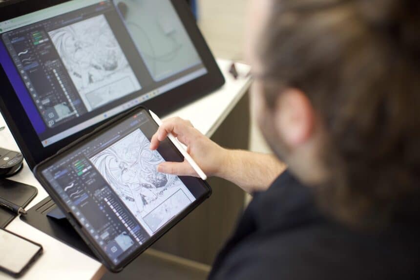 An artist draws comic book art on a tablet at County College of Morris