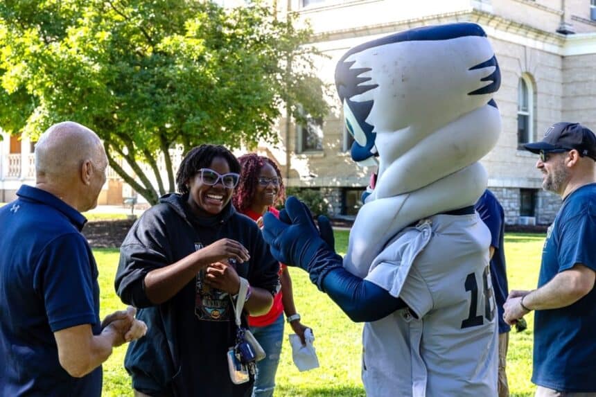 Centenary University freshman Charlotte Sampson celebrates with the Cyclones mascot after receiving the Hill Scholarship in Hackettstown NJ