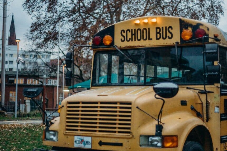 Yellow school bus on a road, illustrating the Denville NJ schools guide