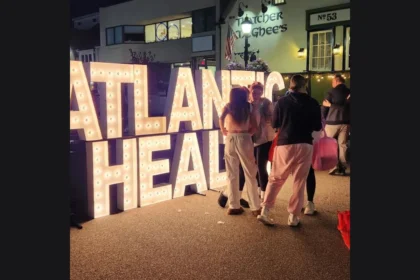 Lighted Atlantic Health marquee letters on Broadway in Downtown Denville, from the Pink Witches Night Out event listing